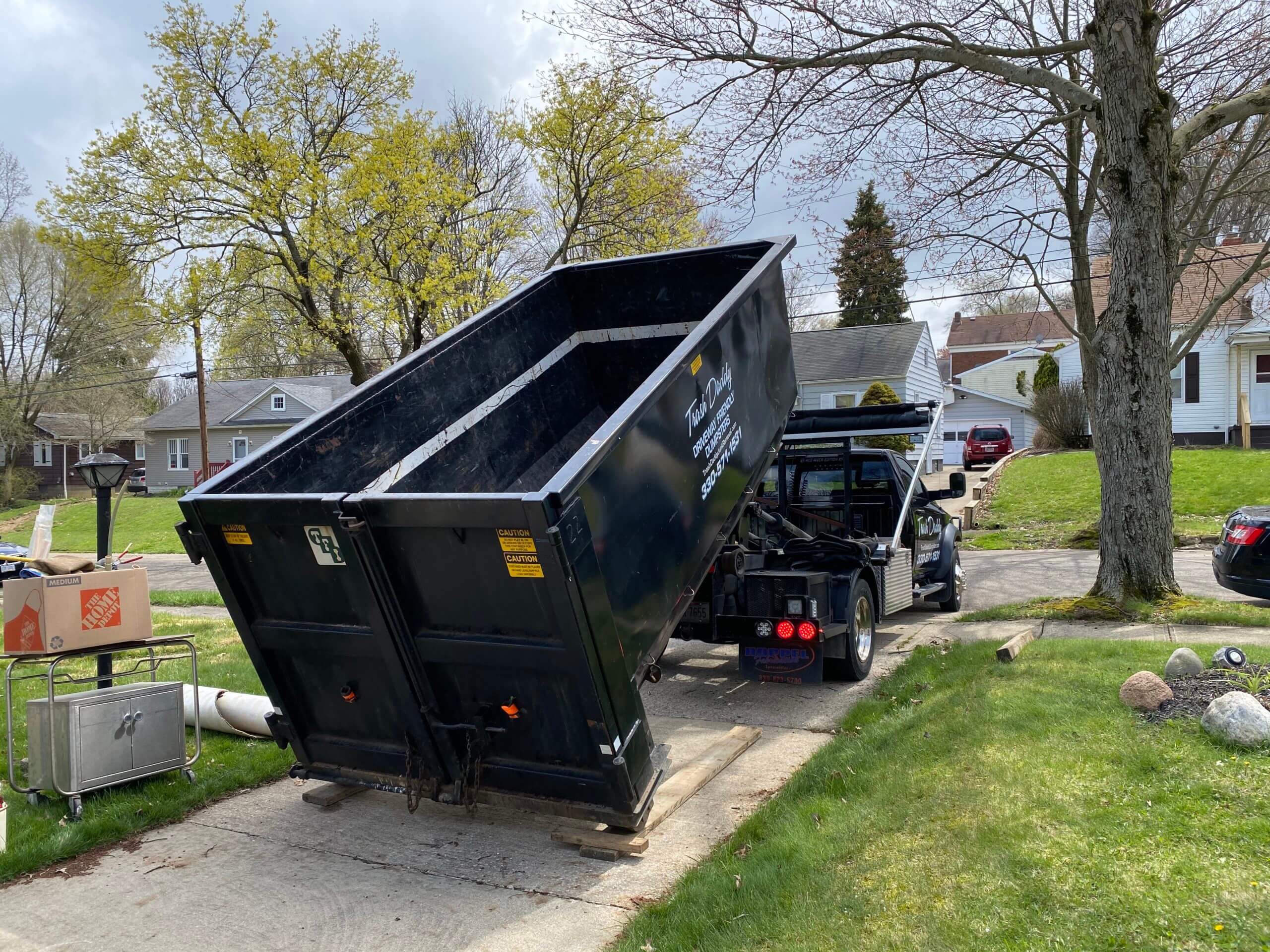 A dump truck parked on the roadside, indicating dumpster rental services in Chesapeake, Virginia.